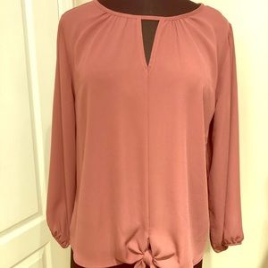 Blouse with tie at center bottom front